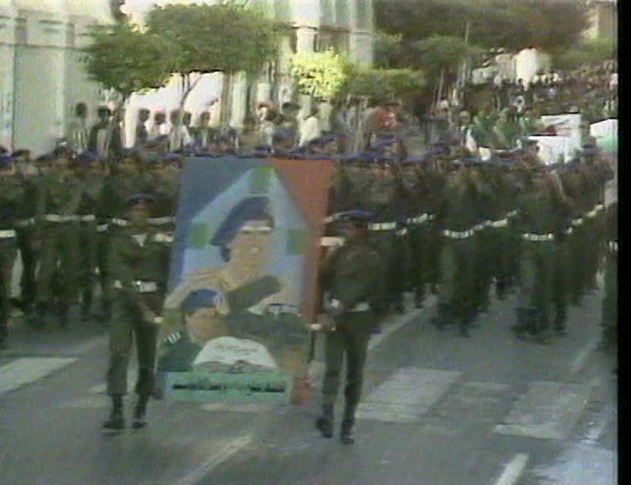 CROWDS IN TRIPOLI WELCOMED THE NEWS, A DELIGHTED GADDAFI WAVING LIKE A GIRL. 