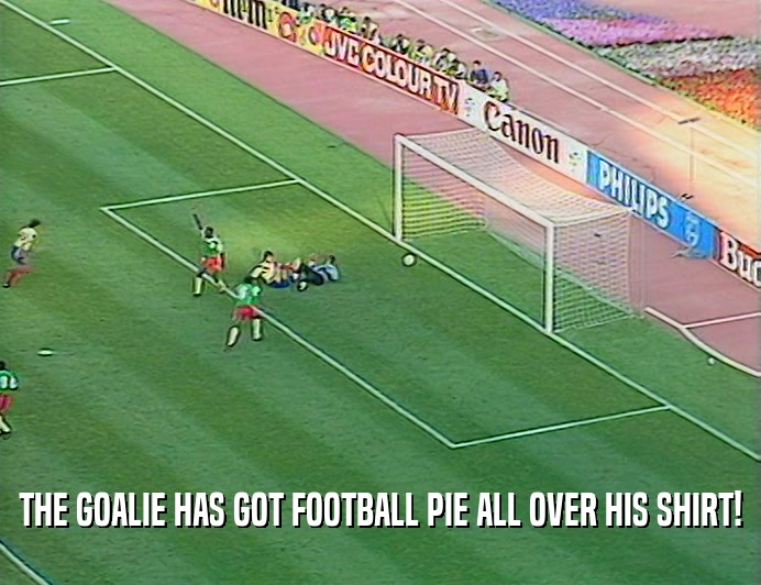 THE GOALIE HAS GOT FOOTBALL PIE ALL OVER HIS SHIRT!  