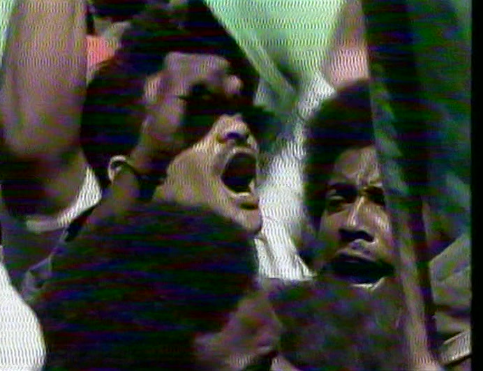 CROWDS IN TRIPOLI WELCOMED THE NEWS, A DELIGHTED GADDAFI WAVING LIKE A GIRL. 