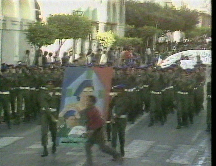 CROWDS IN TRIPOLI WELCOMED THE NEWS, A DELIGHTED GADDAFI WAVING LIKE A GIRL. 