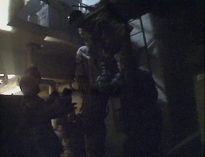 NO ONE KNOWS HOW IT GOT THERE, BUT THESE FIGHTING MEN, MOVED BY THE ANIMAL'S PLIGHT, 