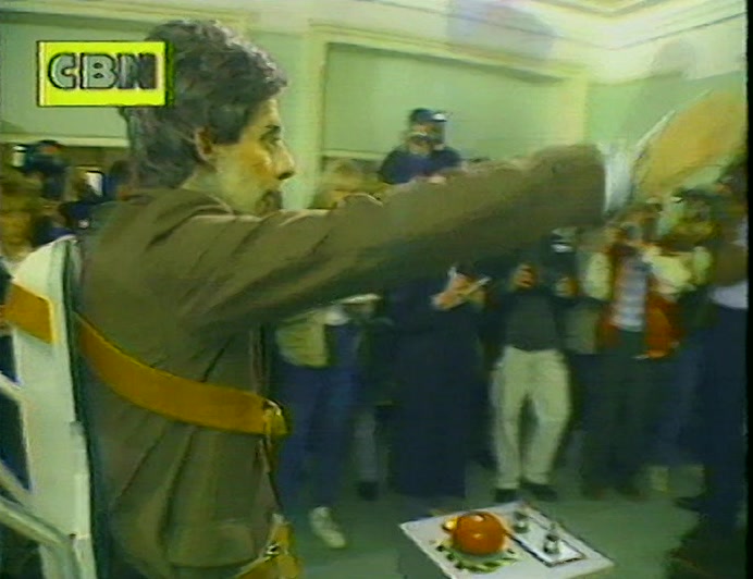 COLIN DECOMPOSES HIMSELF BEFORE DELIVERING A STIFF CHARGE TO BAXTER. 