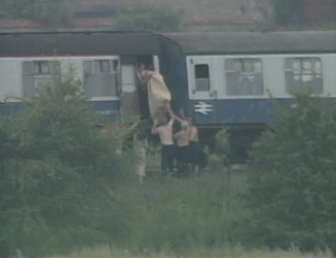 MOST OMINOUSLY, THIS EVENING, THE COMMUTERS WERE SEEN STRUGGLING WITH A SACK 