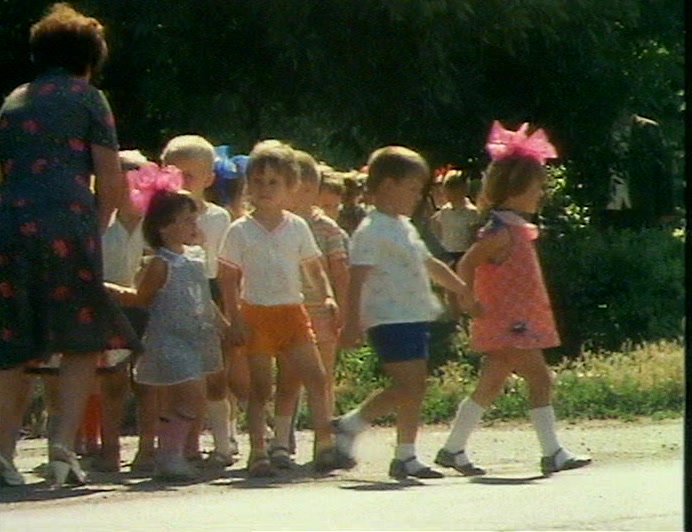 AFTER SCHOOL, THE CHILDREN QUEUE UP FOR THEIR PLUTONIUM, 