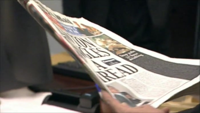 - (MALCOLM) ''LAWTON DANGLES BY A THREAD''? - YEAH. ''DANGLES BY A THREAD''. 