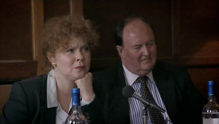 AND WATCHED PETER PLAYING THE TROMBONE IN THE SCHOOL ORCHESTRA. 