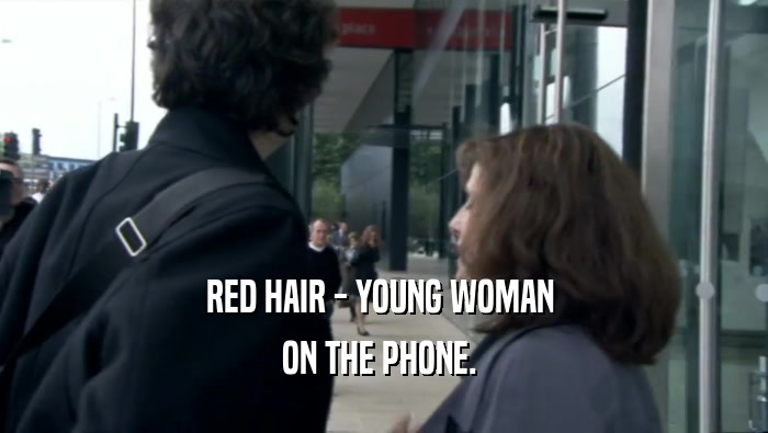 RED HAIR - YOUNG WOMAN  ON THE PHONE.  