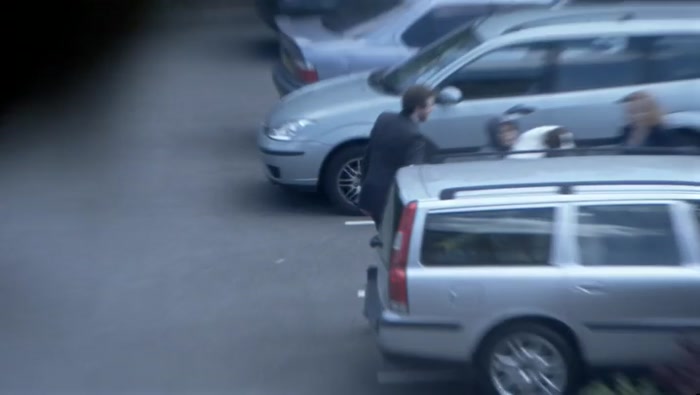 NOW THE DOG'S GOING IN. IS SHE GOING TO PUT JULIE IN THE BOOT? 