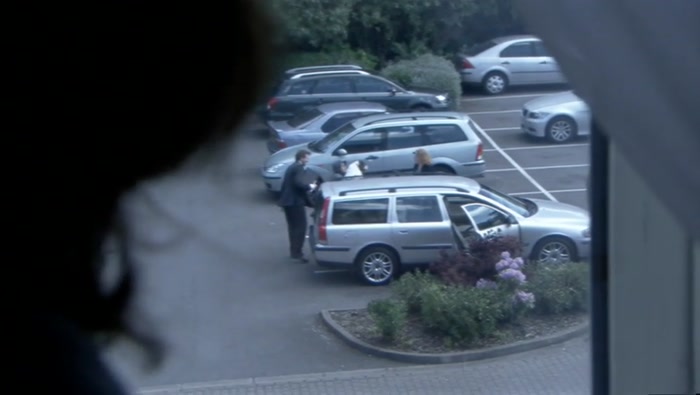 NOW THE DOG'S GOING IN. IS SHE GOING TO PUT JULIE IN THE BOOT? 
