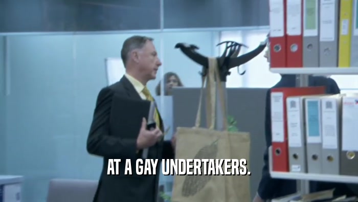 AT A GAY UNDERTAKERS.  