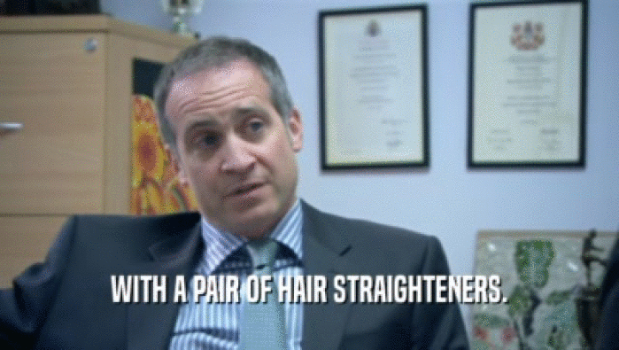 WITH A PAIR OF HAIR STRAIGHTENERS.  