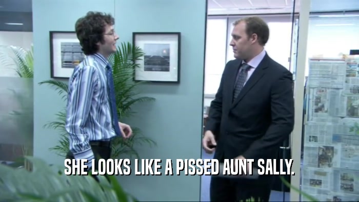 SHE LOOKS LIKE A PISSED AUNT SALLY.  