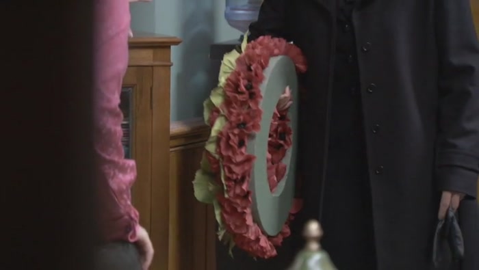 HOLD THE WREATH IN YOUR RIGHT HAND... 