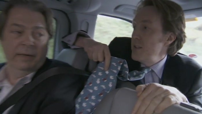 WHAT'S ON YOUR TIE? TINTIN MOON ROCKETS. OH, FOR FUCK'S SAKE. 